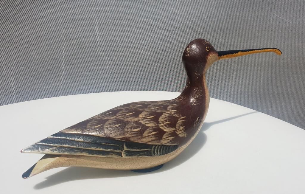 Carved painted wooden curlew