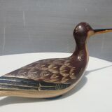 Carved painted wooden curlew