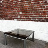 Vintage smoked glass coffee table with chrome structure.