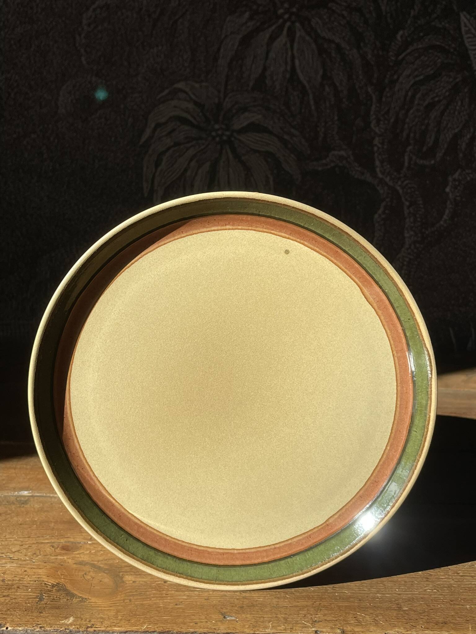 14 stoneware dinner plates, 1970