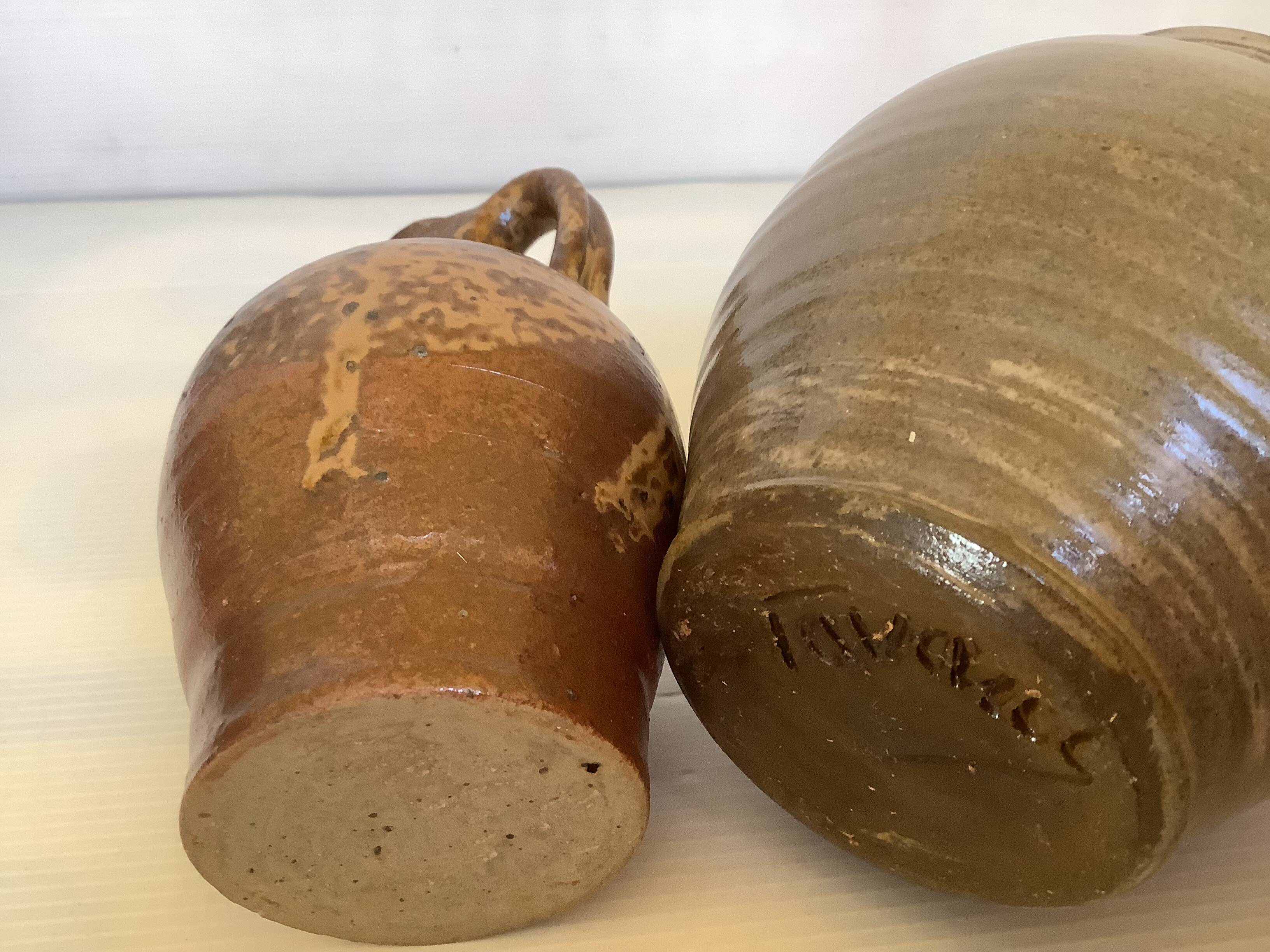 Eight brown ceramic pitcher vases