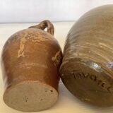 Eight brown ceramic pitcher vases