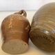 Eight brown ceramic pitcher vases