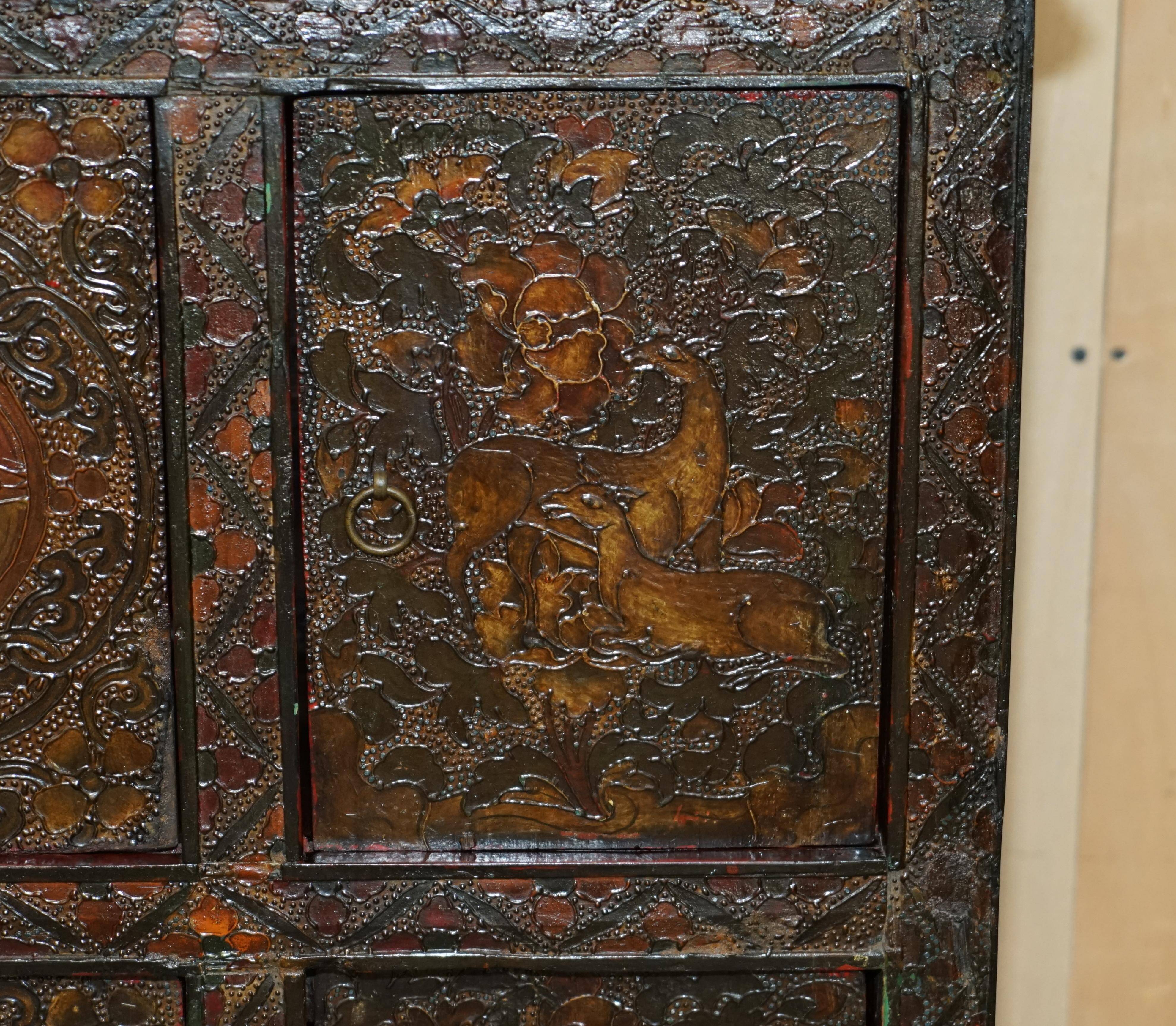 Antique polychrome Tibetan altar cabinet with deer and flowers.