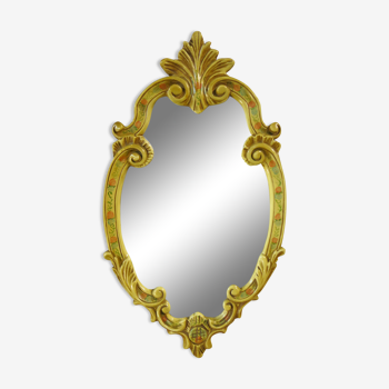 Old mirror in its hand-painted plaster frame