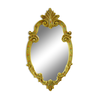 Old mirror in its hand-painted plaster frame