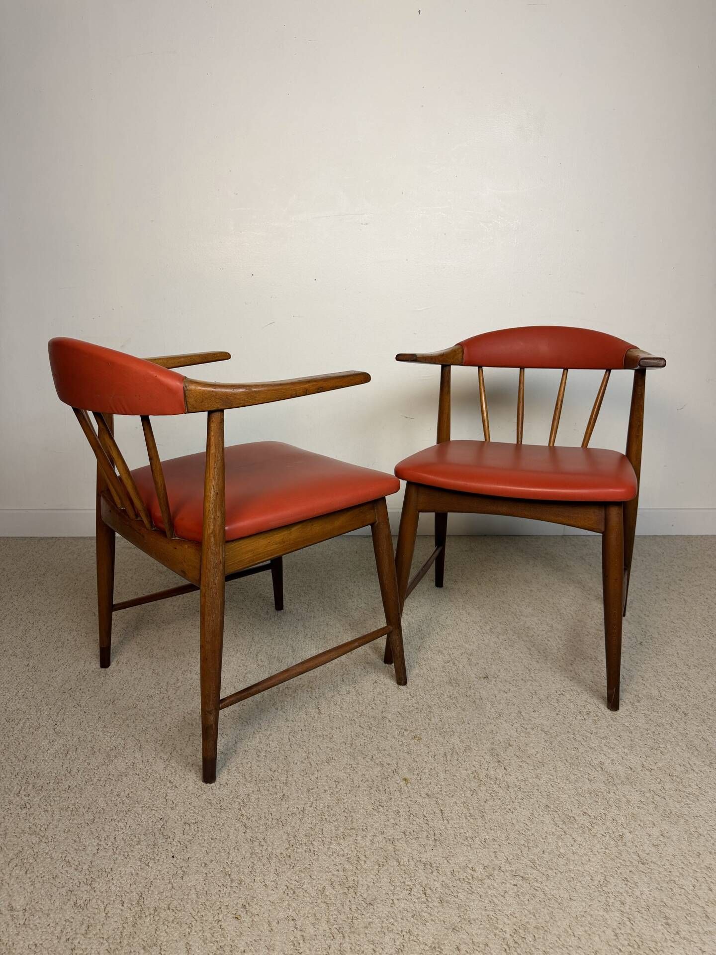 Pair of Scandinavian armchairs in teak and red faux leather – 1960s