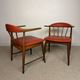 Pair of Scandinavian armchairs in teak and red faux leather – 1960s