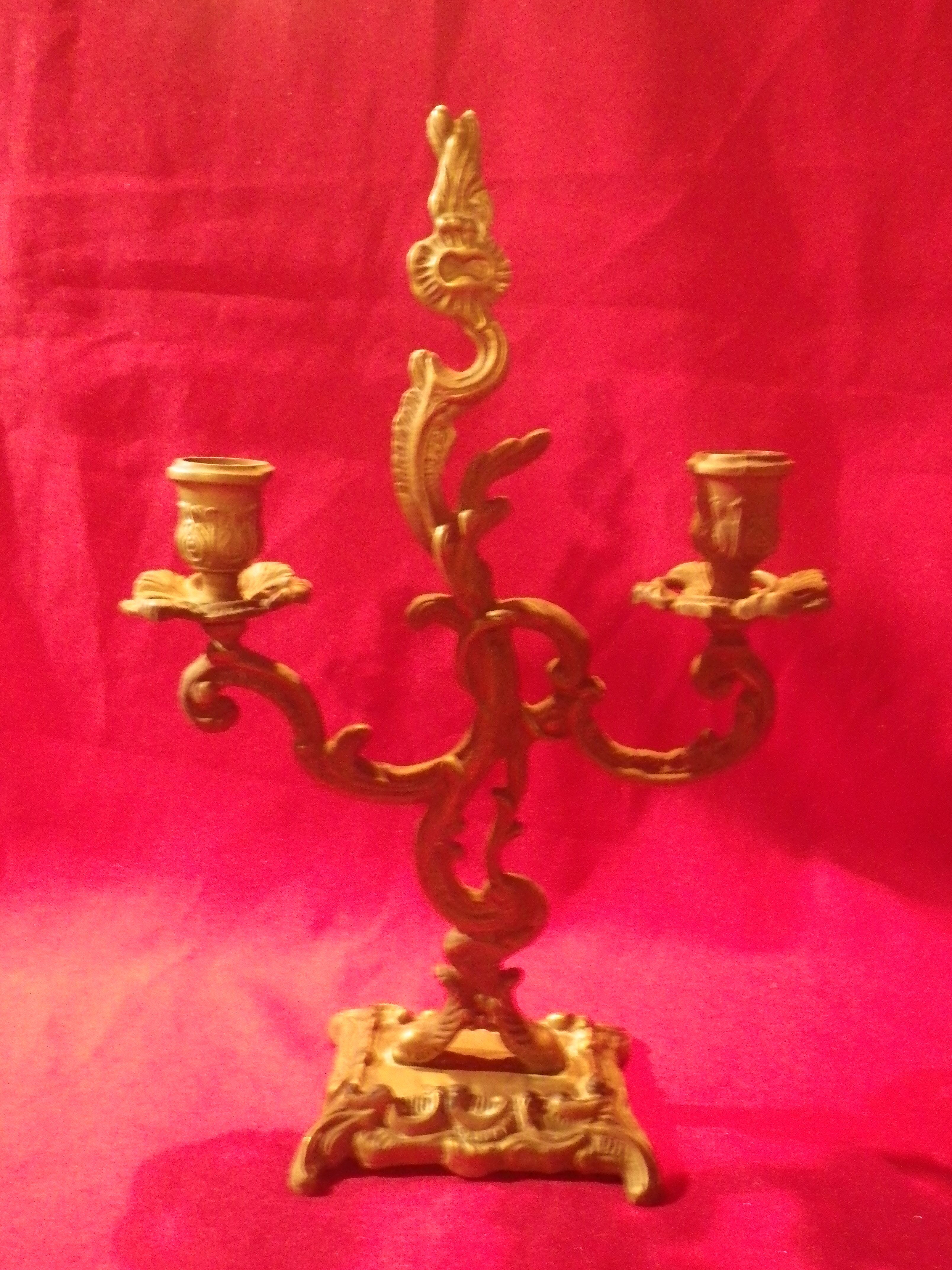 Two brass NCIAN candlesticks