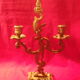 Two brass NCIAN candlesticks