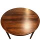Round dining table in rosewood.