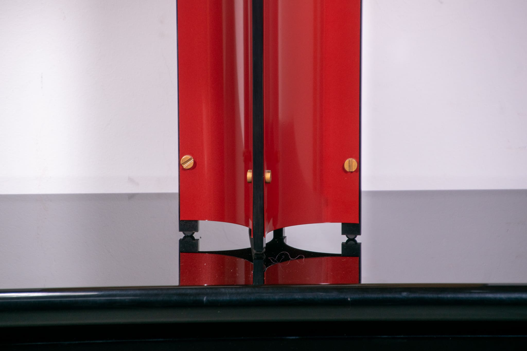 Red metal sculptural table lamp with oversized lamp shade circa 1980