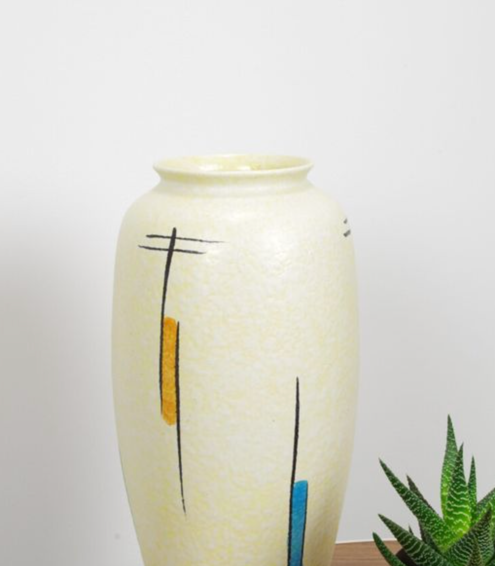 Vintage vase in light yellow porcelain
