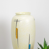Vintage vase in light yellow porcelain