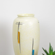 Vintage vase in light yellow porcelain