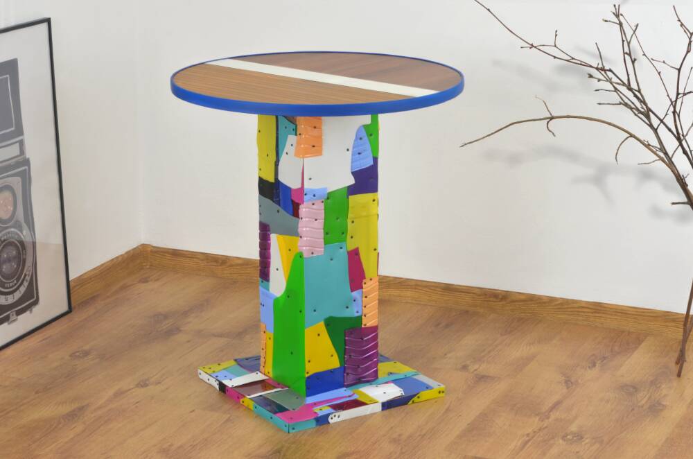 Handmade table made from recycled materials, colourful, abstract.