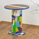 Handmade table made from recycled materials, colourful, abstract.