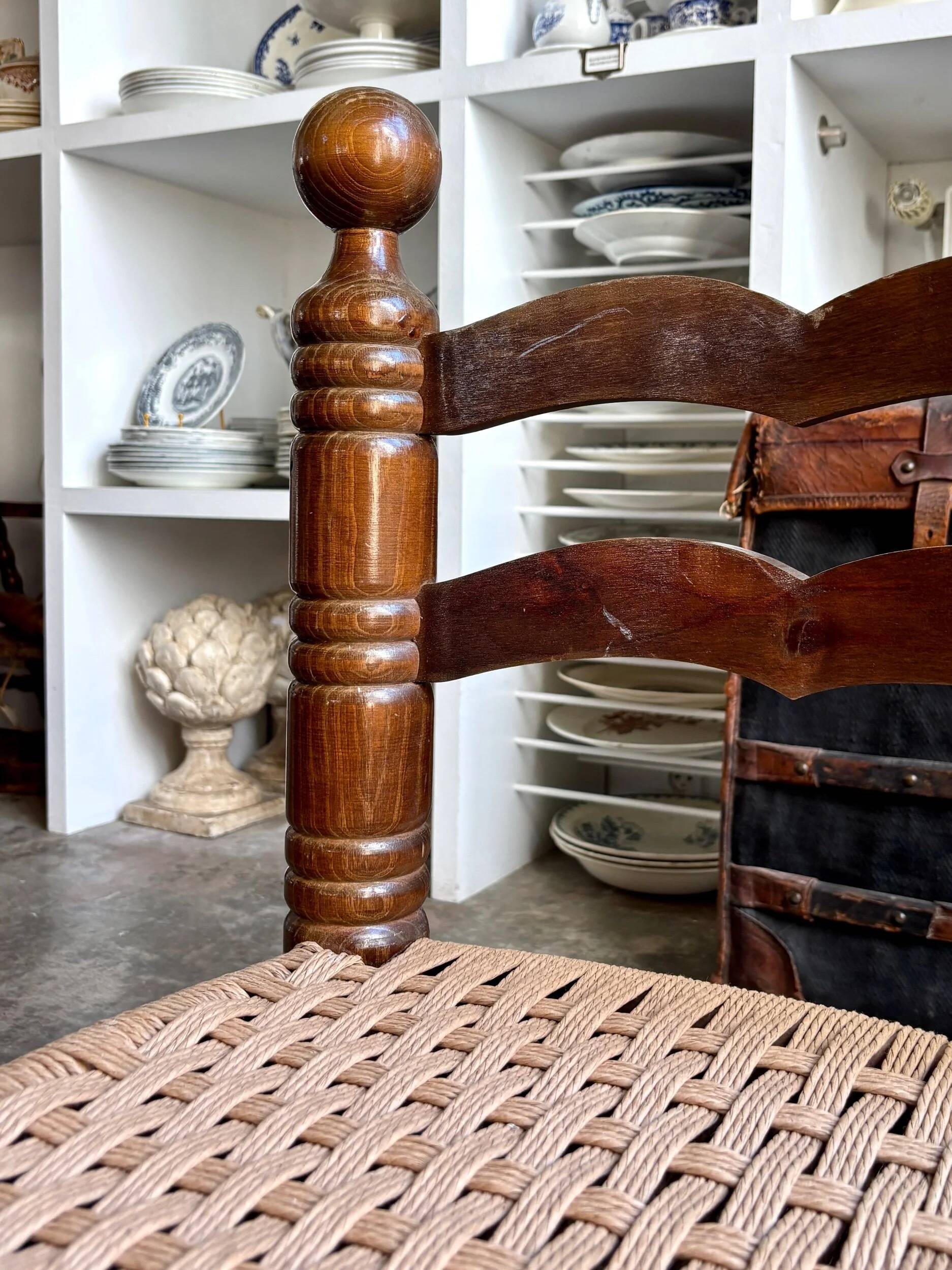 Low chair in dark wood and woven Danish cord attributed to Charles Dudouyt.