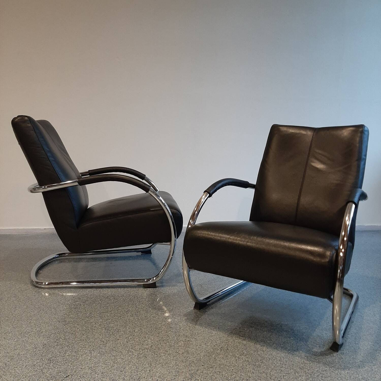 Pair of tubular armchairs