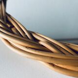 Round mirror in vintage wicker