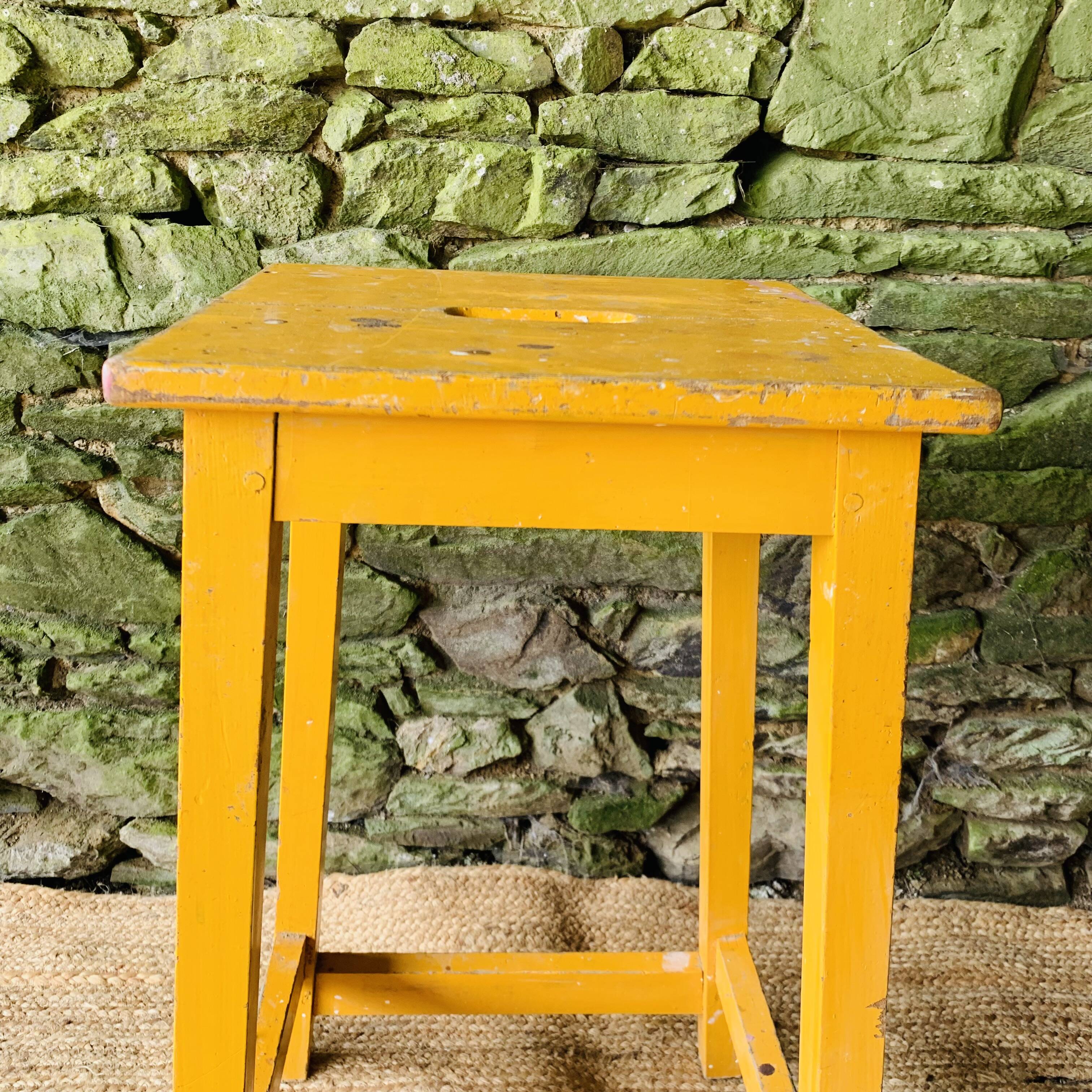 Yellow wooden high stool