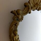 Gilded bronze mirror with angels and scrolls