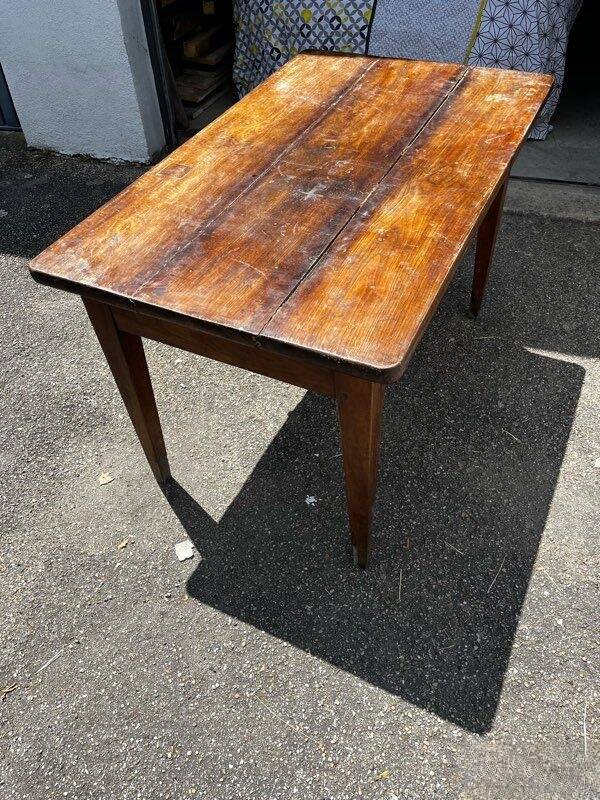 Old wooden table with a drawer