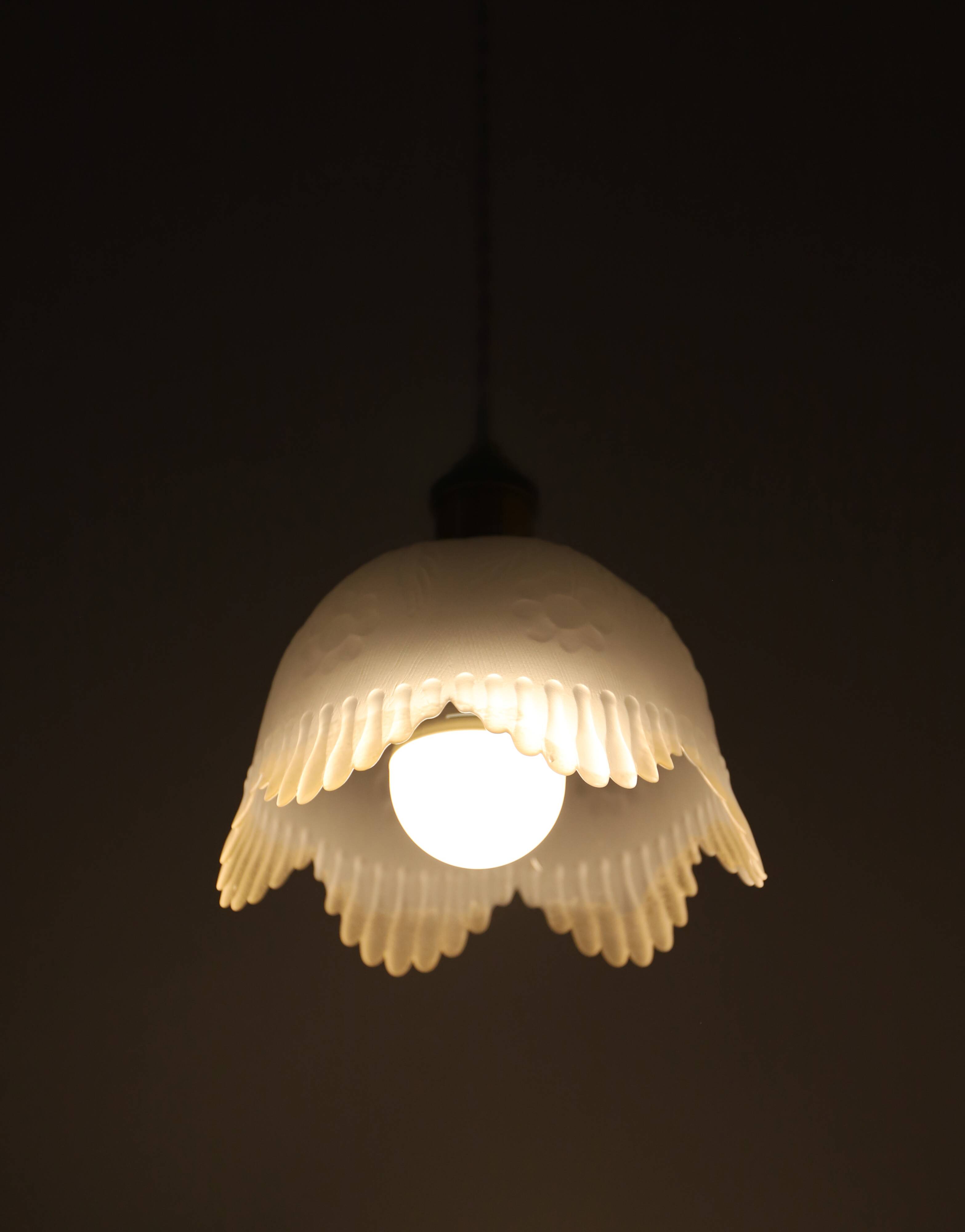 Frosted glass pendant light with floral pattern and wavy edge