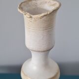 Candle holder on his tin cup