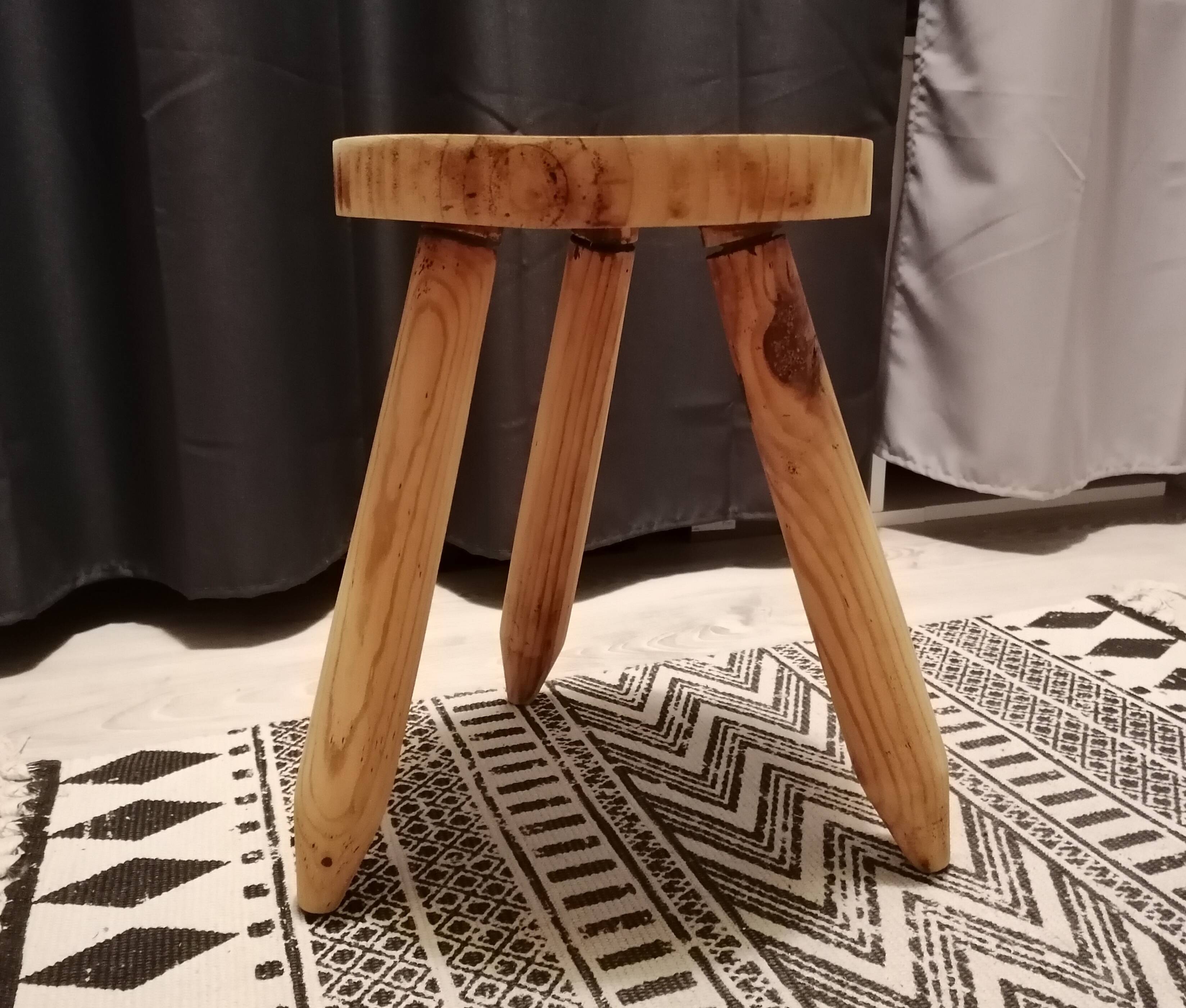 Wooden tripod farm stool