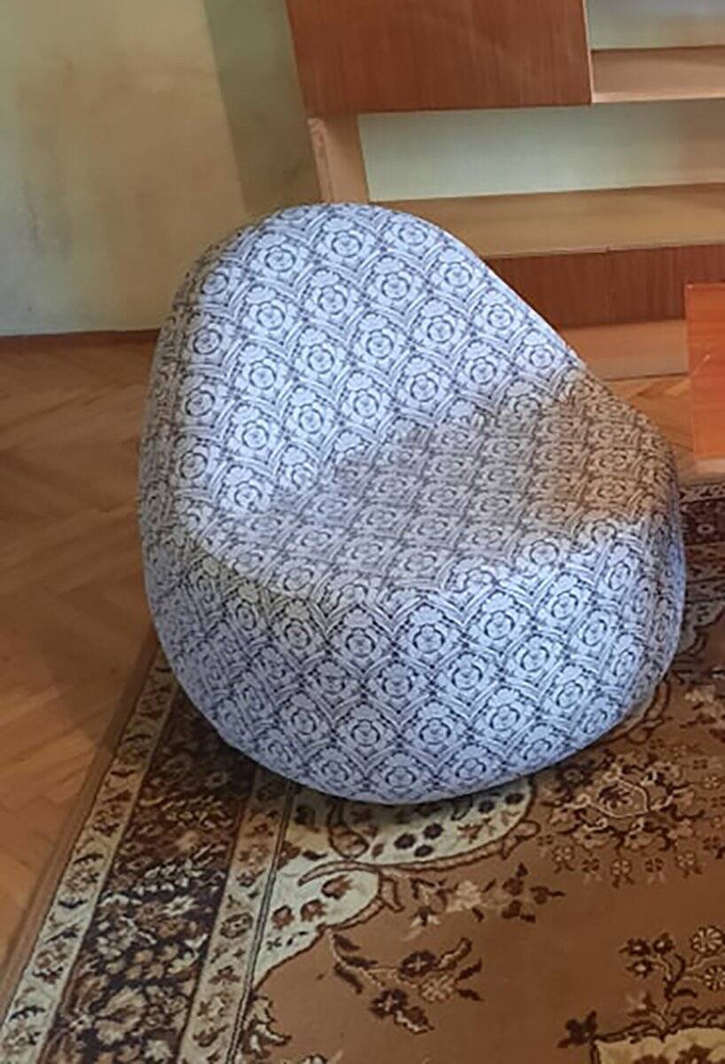 1970s vintage armchair in multicoloured patterned fabric, rounded silhouette