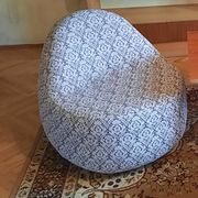 1970s vintage armchair in multicoloured patterned fabric, rounded silhouette