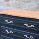 Louis XV style black commode with natural wood top – 3 drawers
