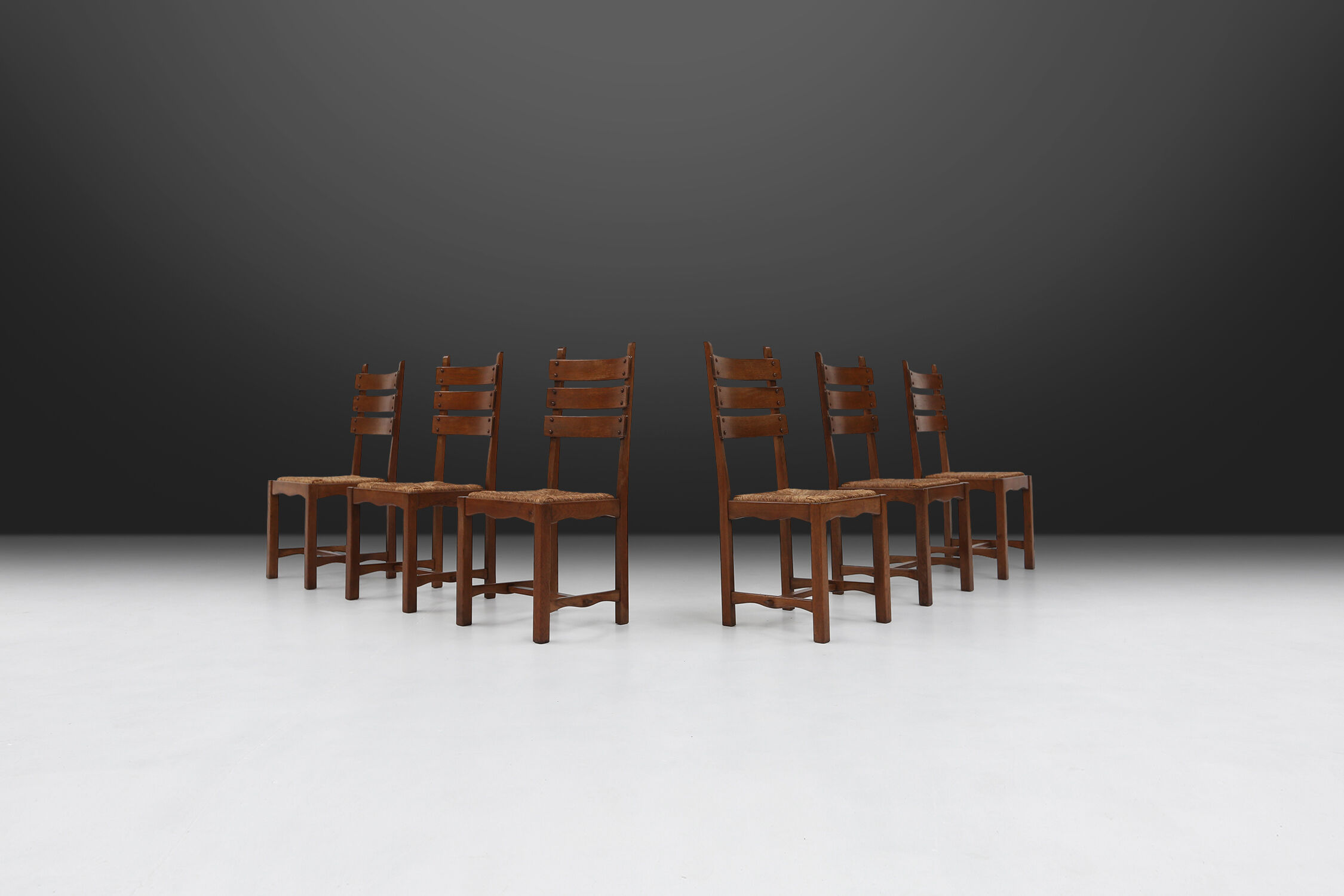 Set of six brutalist dining chairs in oak an wicker
