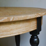 Round table in coloured cerused oak, waxed coloured feet