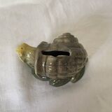 Old snail piggy bank in barbotine