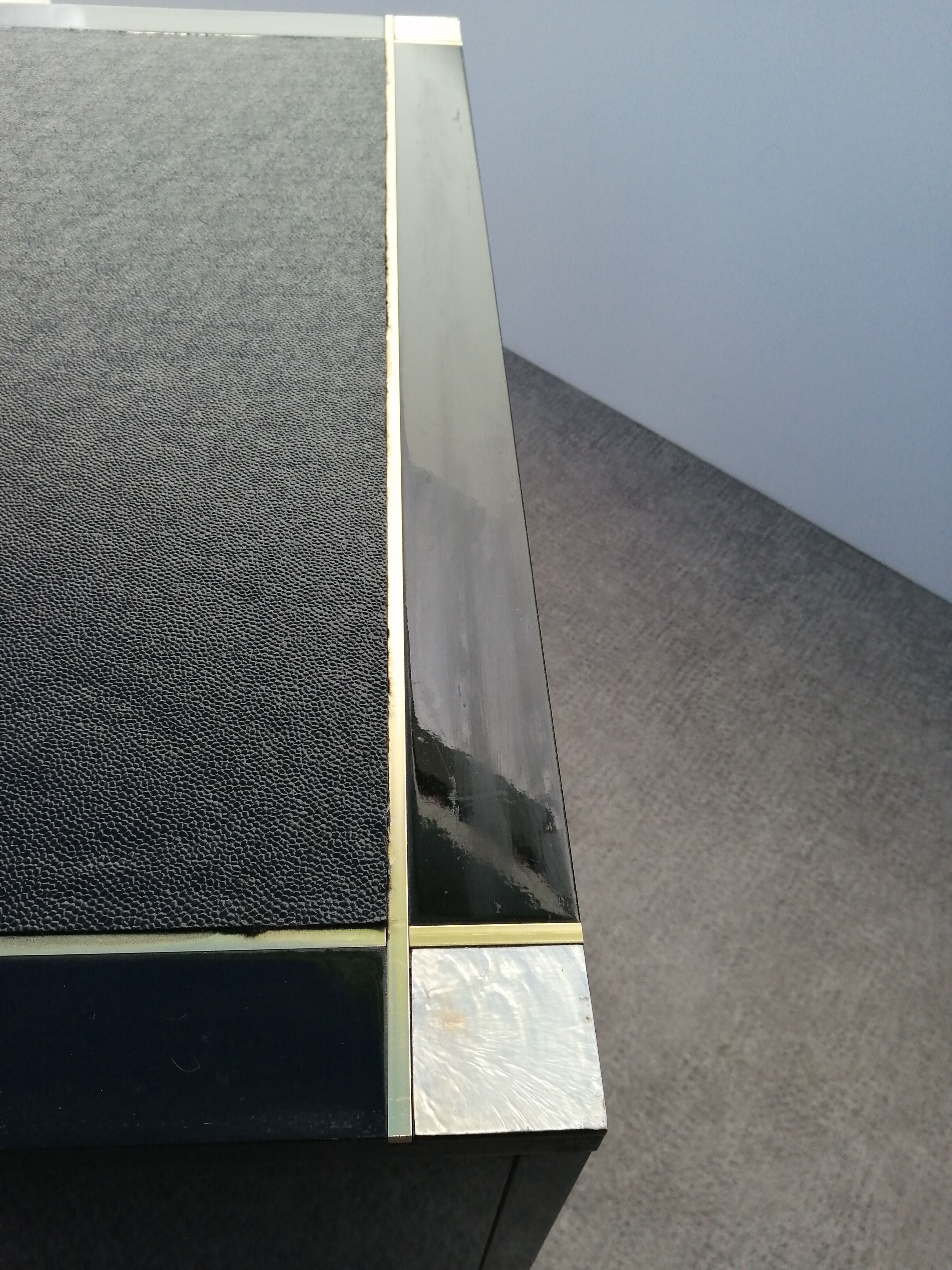 Designer coffee table in black lacquered wood and vintage brass