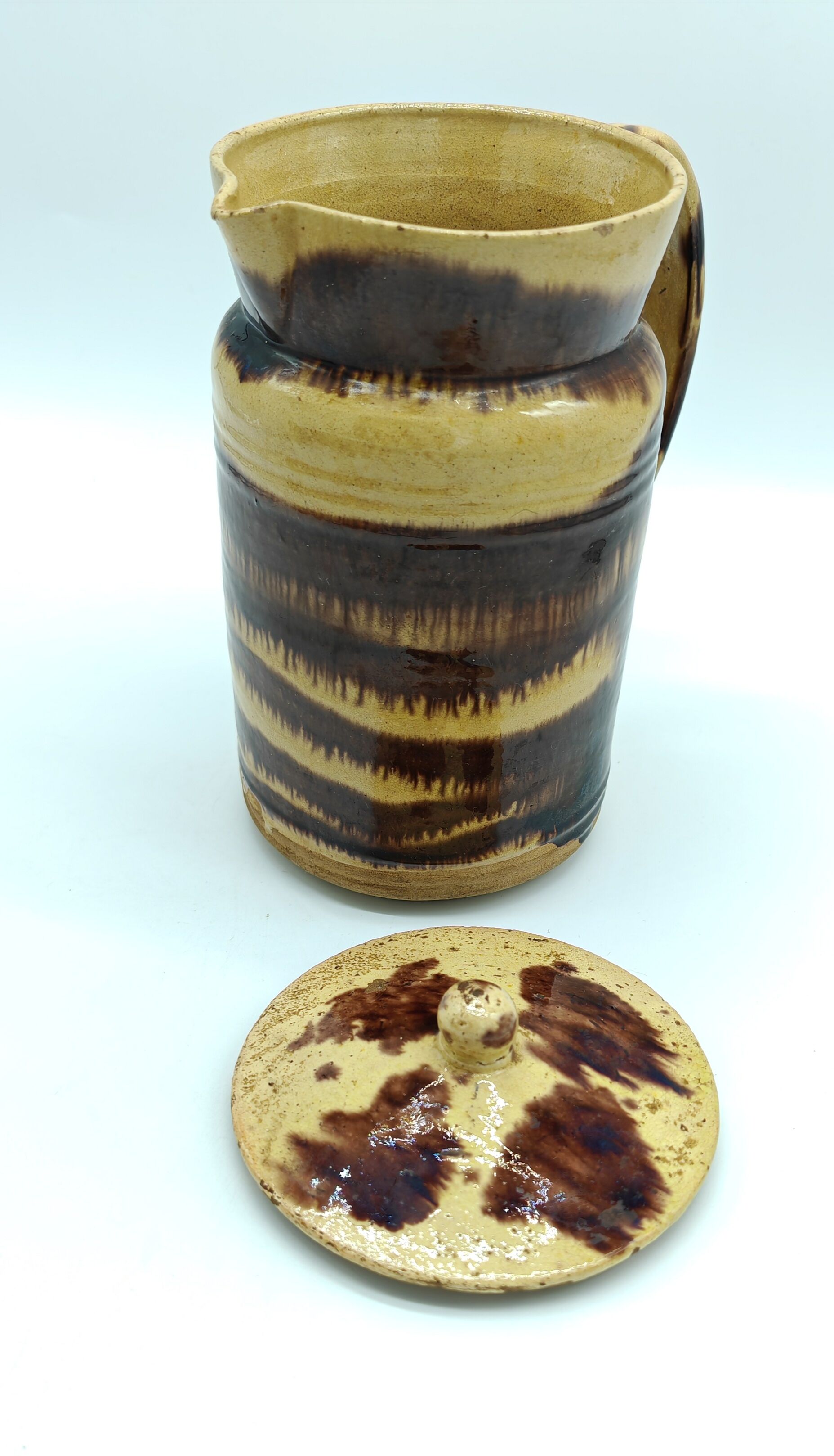 Pitcher covered in glazed earth old french tabby dishes