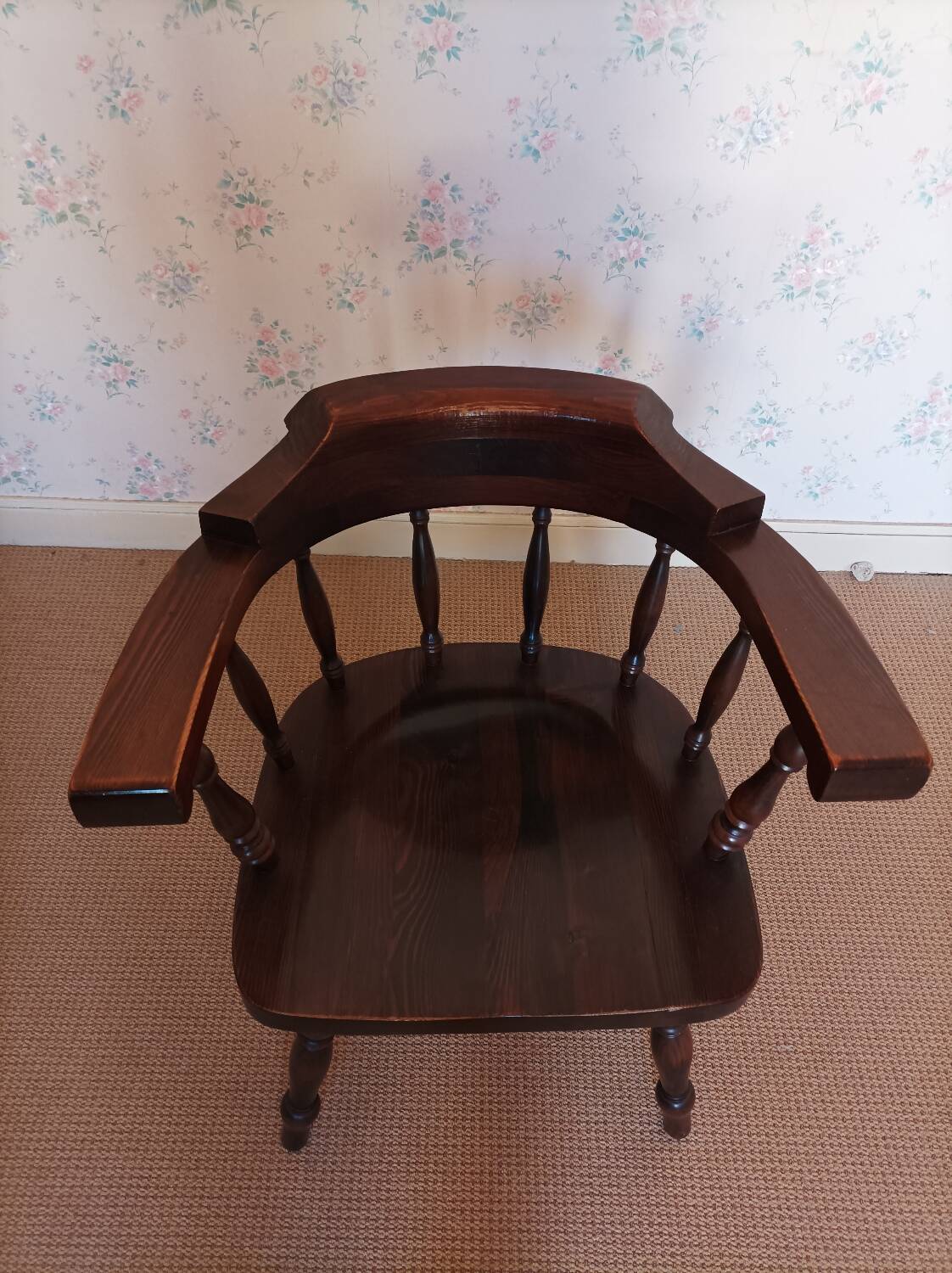 Armchair with wooden armrests