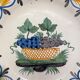 Plat en faïence de nevers de style XVIIIe à décor de corbeille aux grappes de raisin