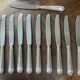Set of 12 silver-plated metal knives, shell model, from CAILAR BAYARD