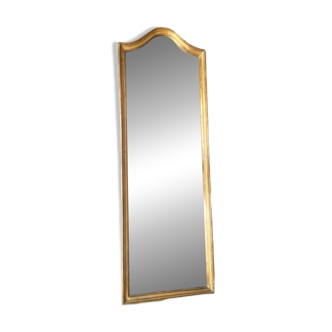 Large beveled mirror in golden wood
