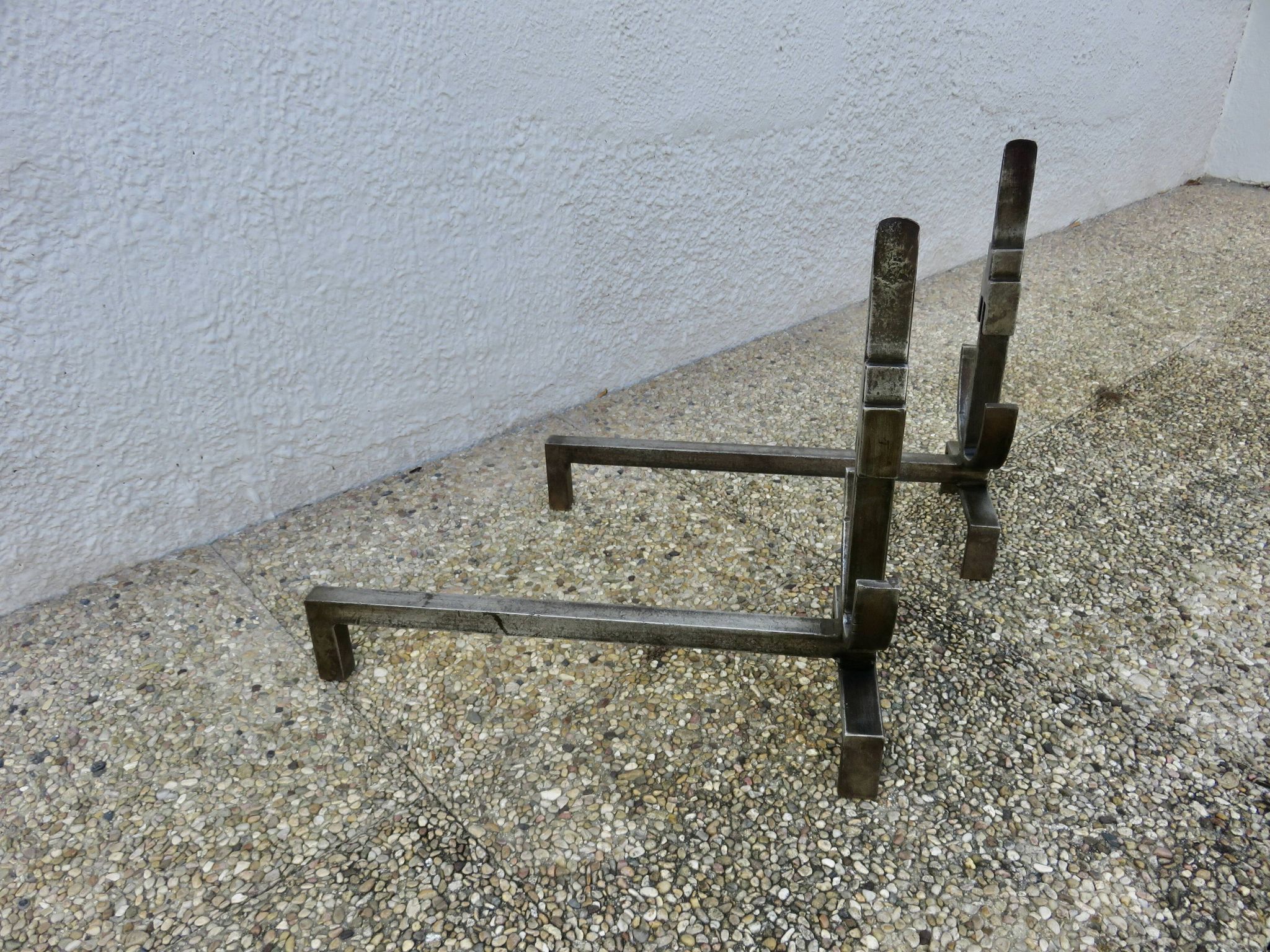 Pair of modernist andirons in forged and hammered steel, French work