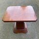 Art Deco dining table in rosewood from the 1950s with a central leg.