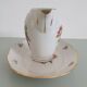 Pot à lait et son plat de présentation en porcelaine émaillée de Limog