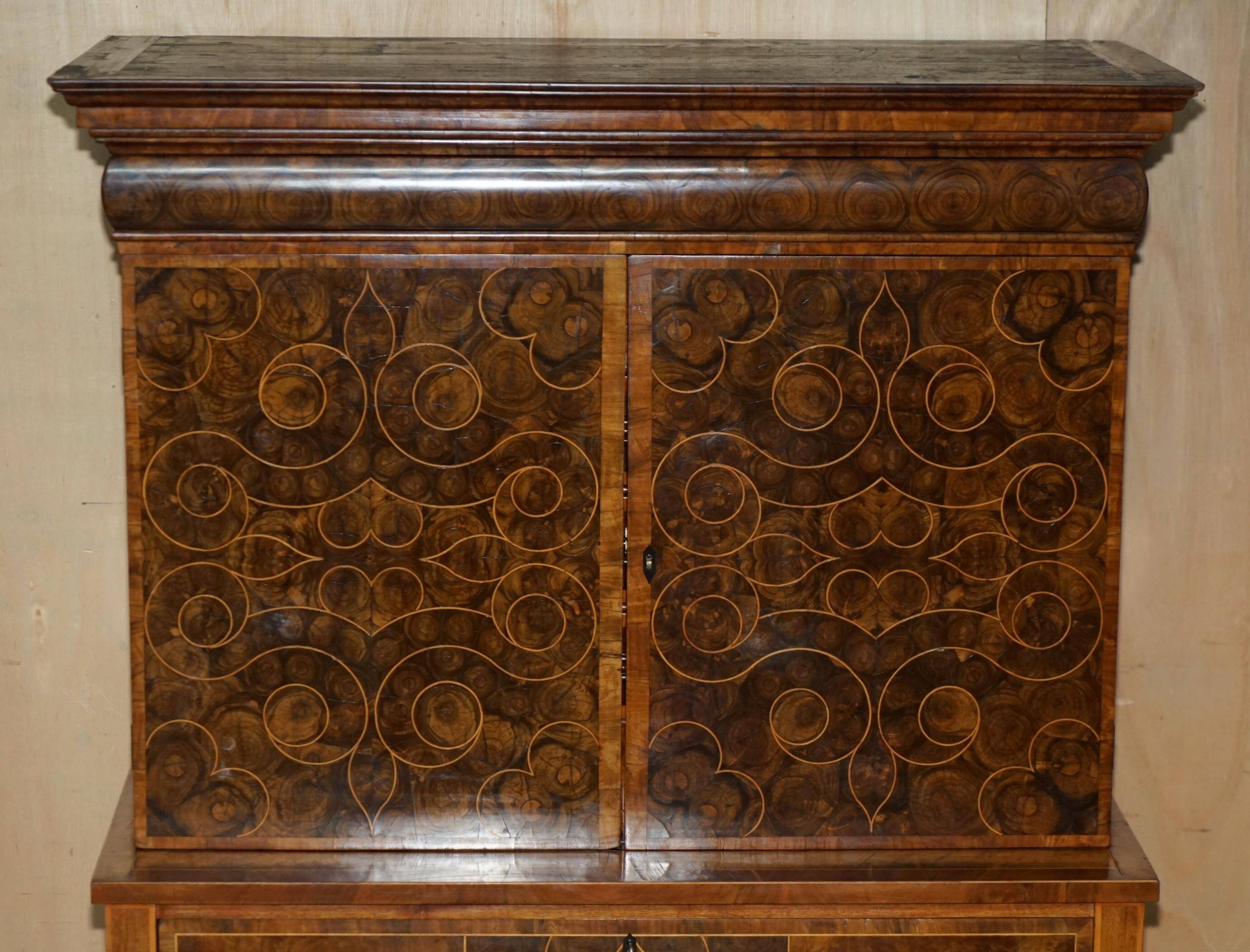 Queen Anne style pedestal commode from around 1710 in walnut and oyster veneer.