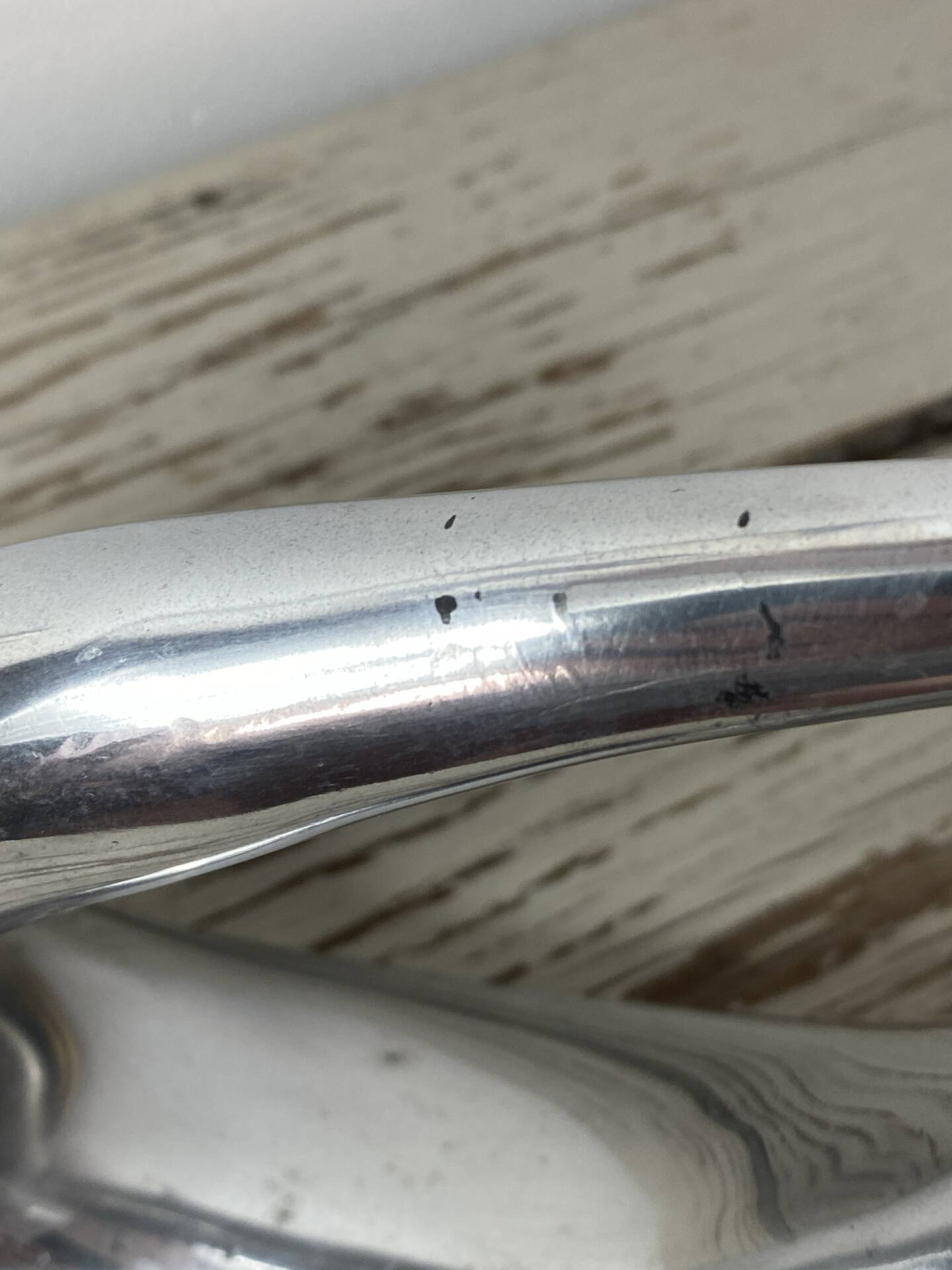 Sculptural vase design in polished aluminium.