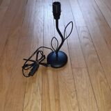 Lamp in metal with shade.