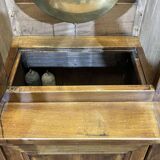 Library in walnut and oak from the early 20th century with its central clock.