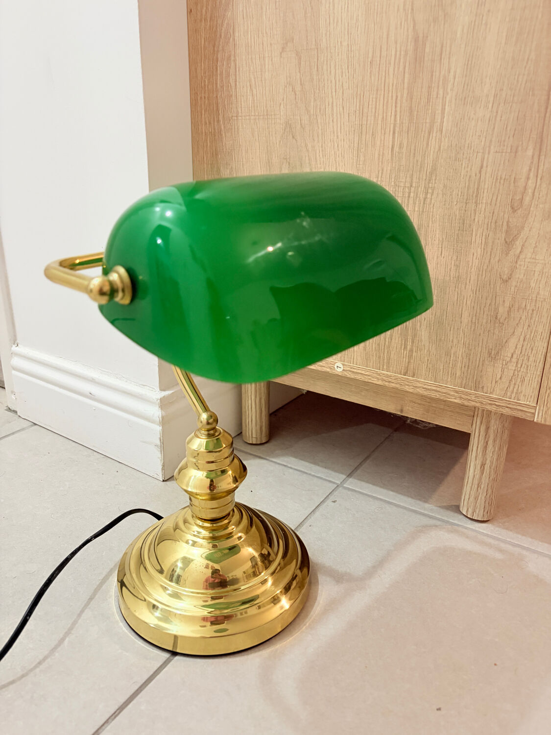 Gold and green banker’s desk lamp.